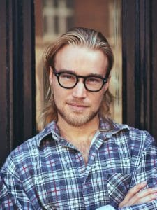 portrait-of-smiling-attractive-man-e1636476261489.jpg
